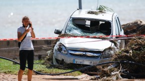 Woman on the phone after car crash