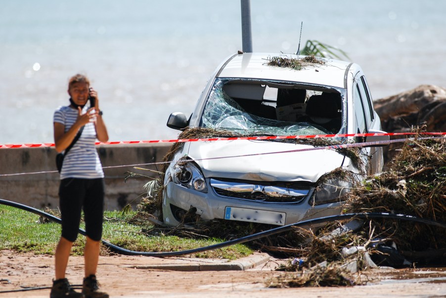 Woman on the phone after car crash