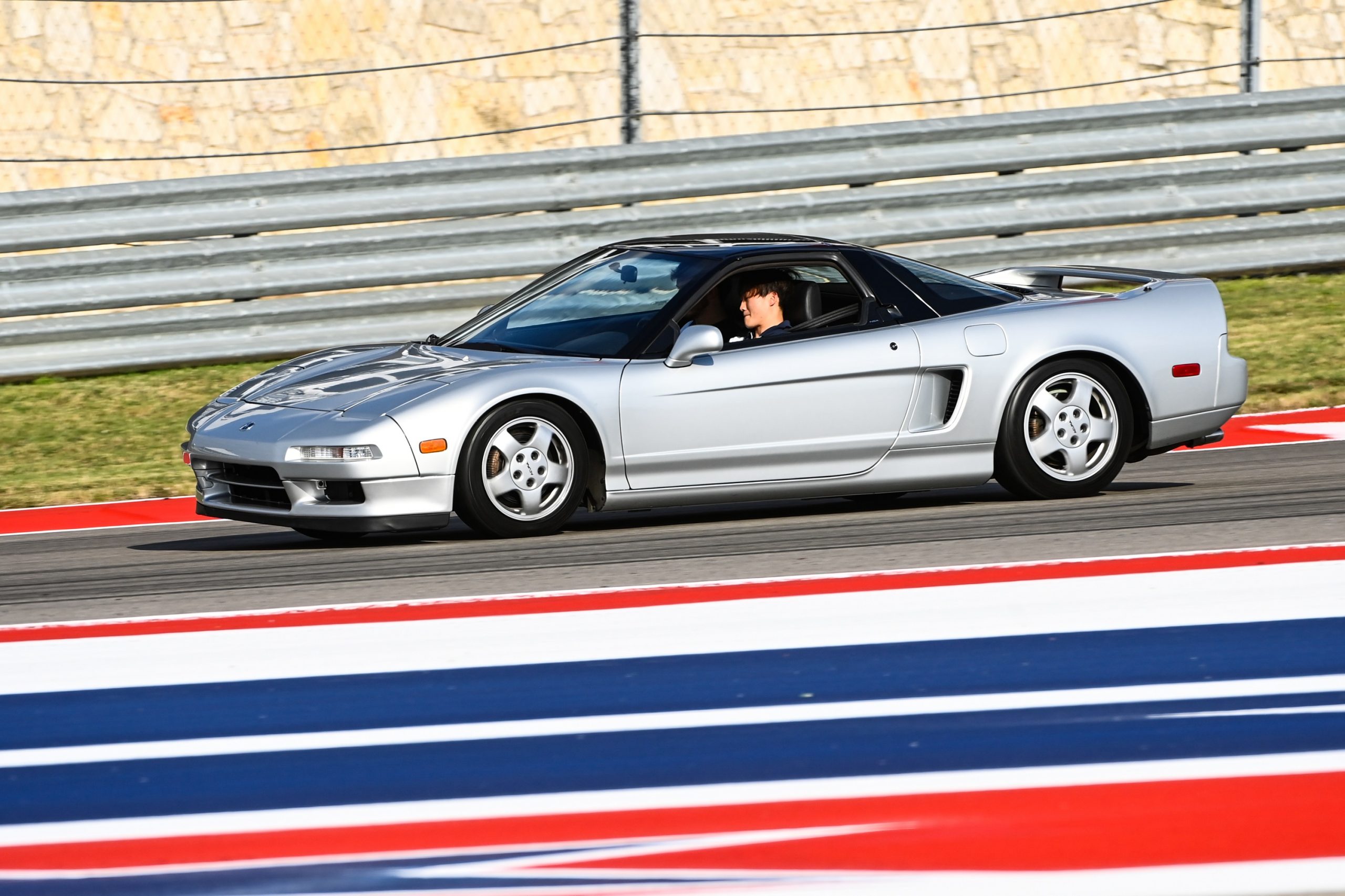 Yuki Tsunoda at the wheel of an Acura NSX