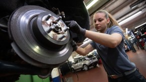 Car mechanic fixing the brakes