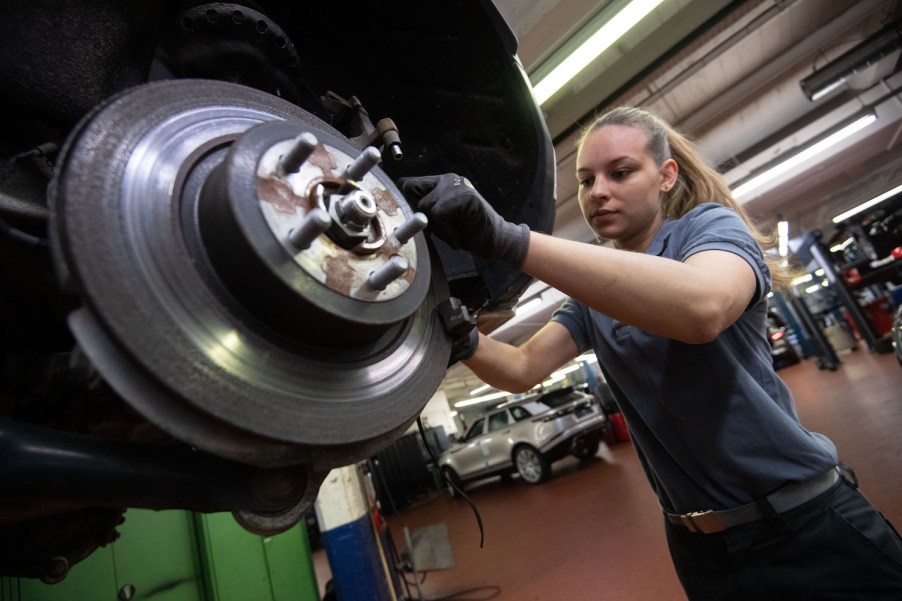 Car mechanic fixing the brakes