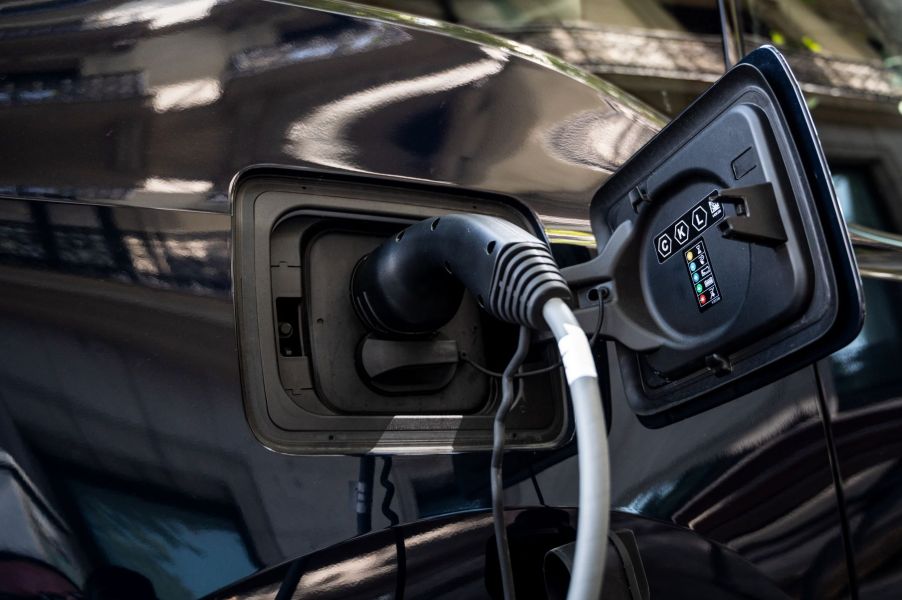 An EV being charged at a charging point station in Madrid, Spain