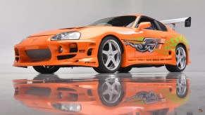 The Fast and Furious Supra as seen in a photo studio with a reflective floor