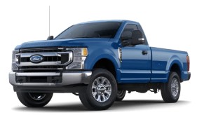 A bright blue Ford F-250 against a white background.