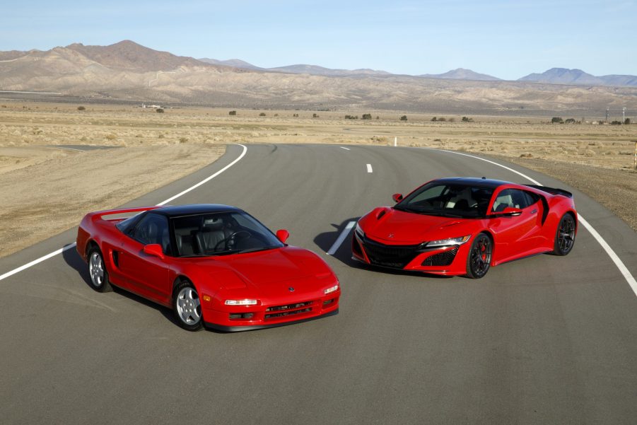 A pair of red Acura NSX sports cars shot side by side in profile