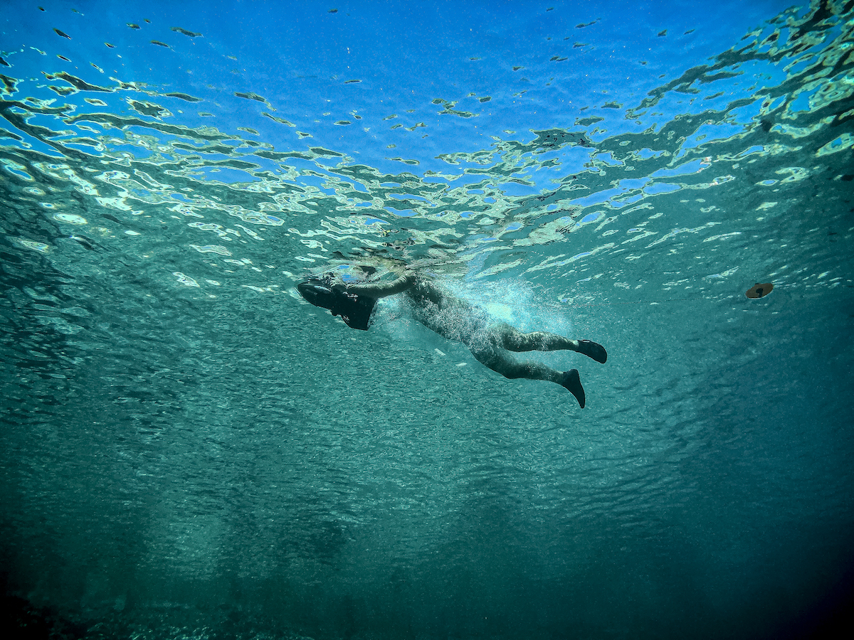 A diver swims with a sea scooter in August 2019