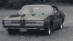 A 1969 Pontiac GTO in a grassy field