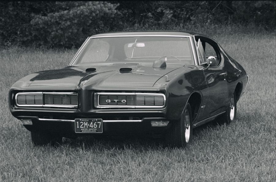 A 1969 Pontiac GTO in a grassy field