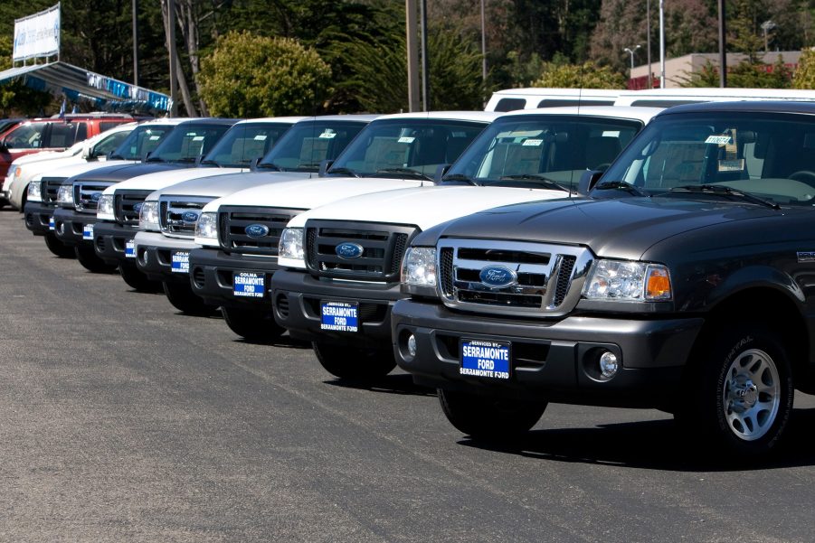 a dealer's lot loaded with 2011 Ford Ranger models, the last generation before its discontinuation.