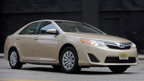 A Toyota Camry, one of the best used midsized cars, shot from the front 3/4