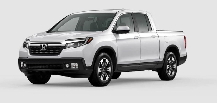 A white Honda Ridgeline against a white background.