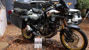 The side view of the black-gold-and-white 2021 Honda Africa Twin Adventure Sports Overland Expo at SEMA 2021