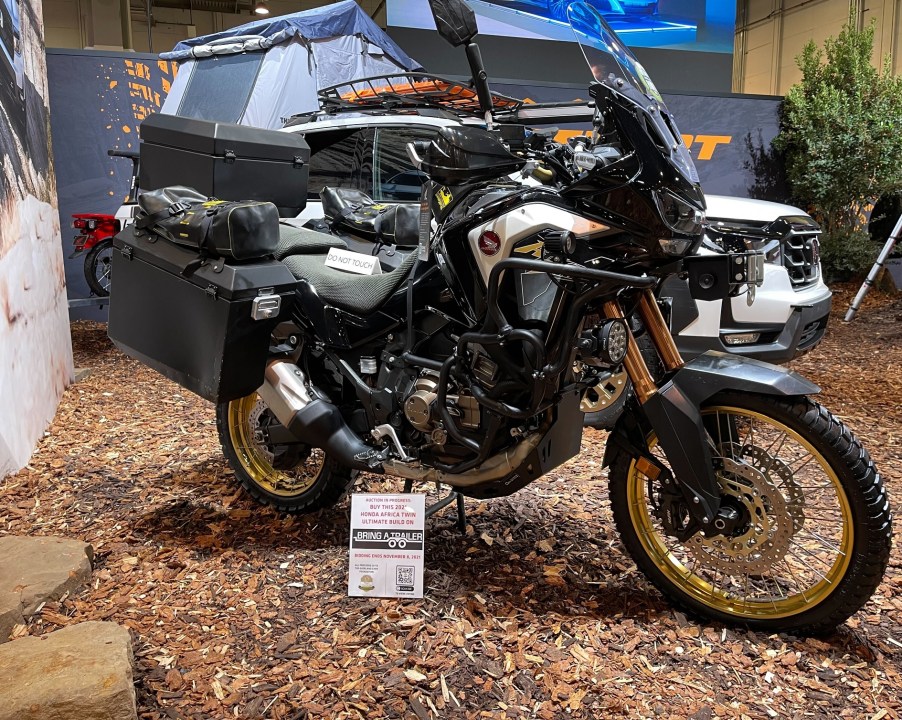 The side view of the black-gold-and-white 2021 Honda Africa Twin Adventure Sports Overland Expo at SEMA 2021