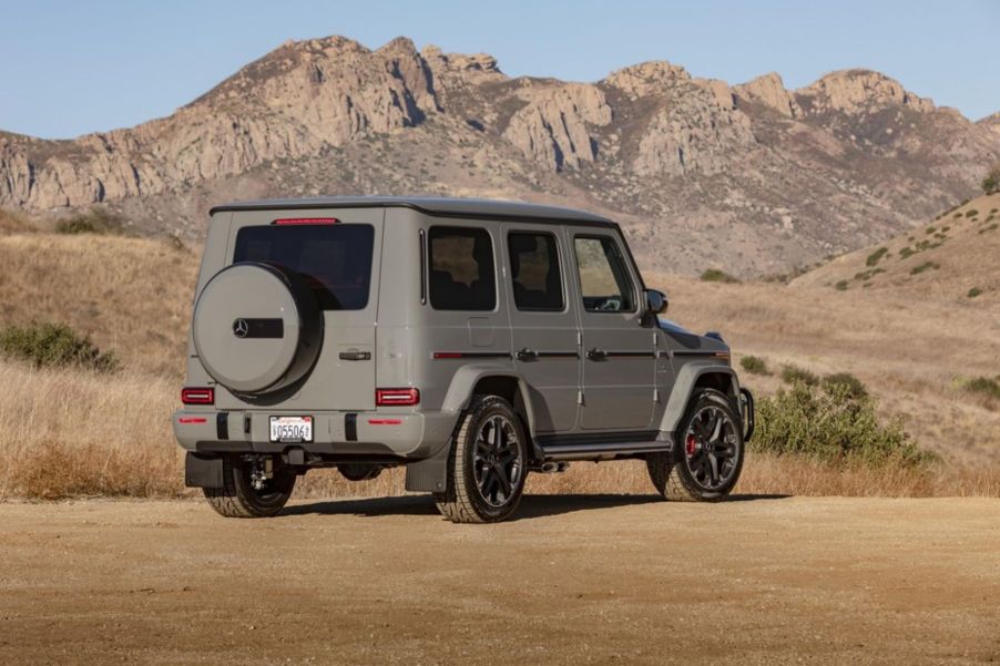 The 2021 Mercedes-Benz AMG G-Class G 63 luxury full-size SUV with a tan beige paint color option parked in the desert