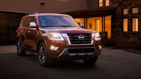 The 2021 Nissan Armada parked near a house