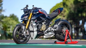 A black-and-gray 2022 Ducati Streetfighter V4 SP on a rear-wheel stand on a racetrack