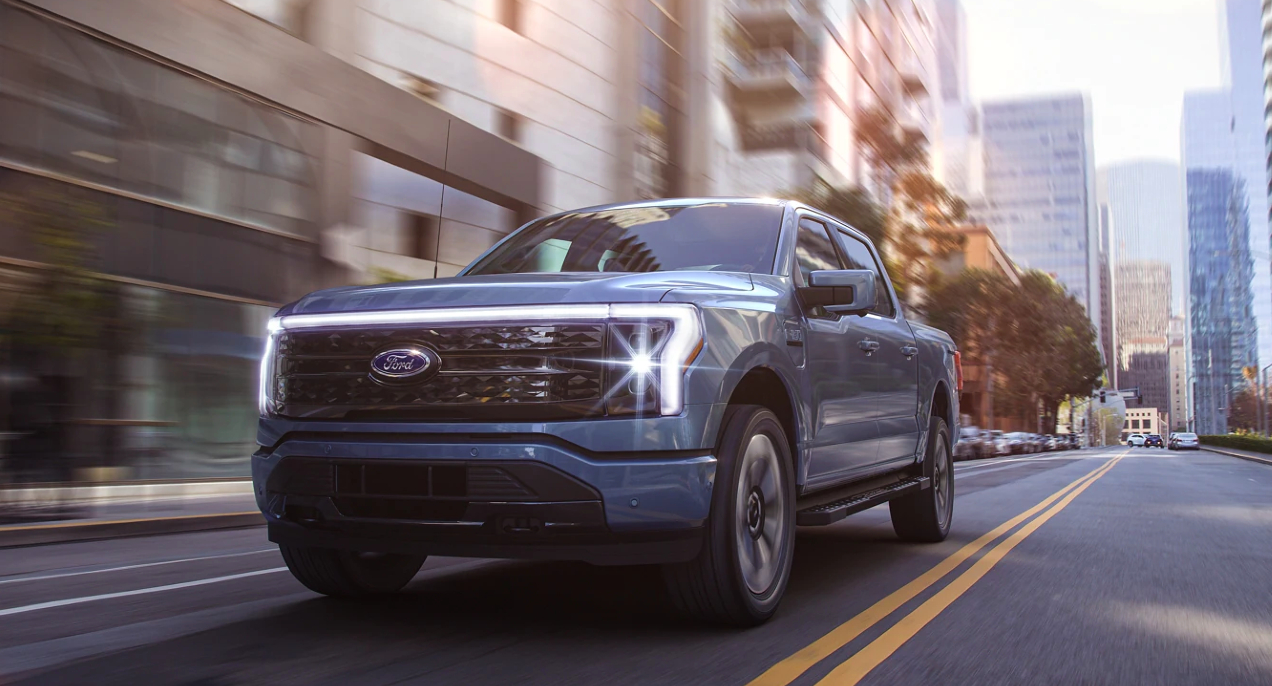 Ford F-150 Lightning electric truck driving on a public road