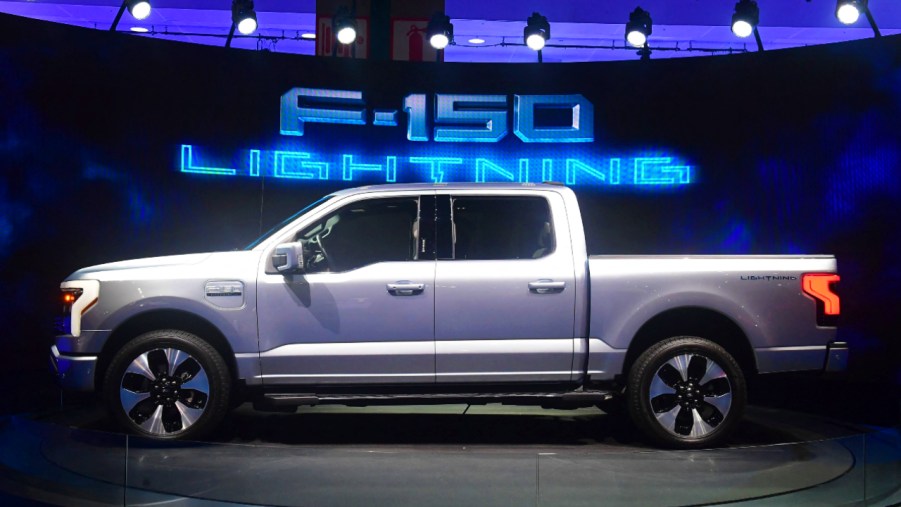 A silver 2022 Ford F-150 Lightning is on display.