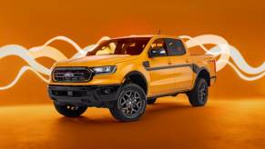 A yellow 2022 Ford Ranger Splash against an orange background.