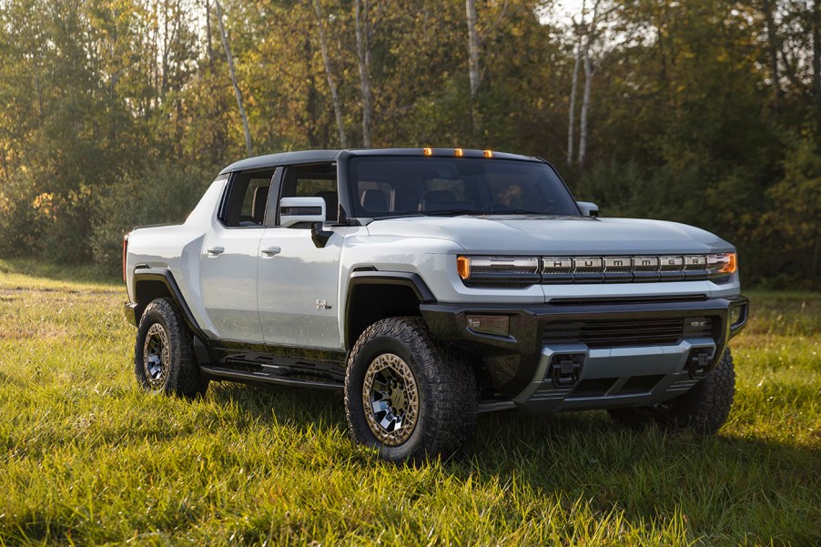 2022 Hummer EV pickup truck parked on a grassy field