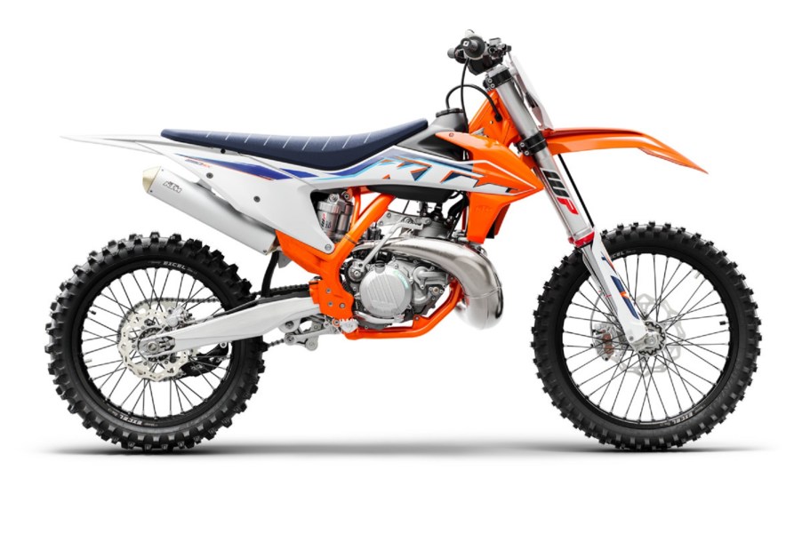 The side view of an orange-white-and-blue 2022 KTM 250 SX motocross 2-stroke dirt bike