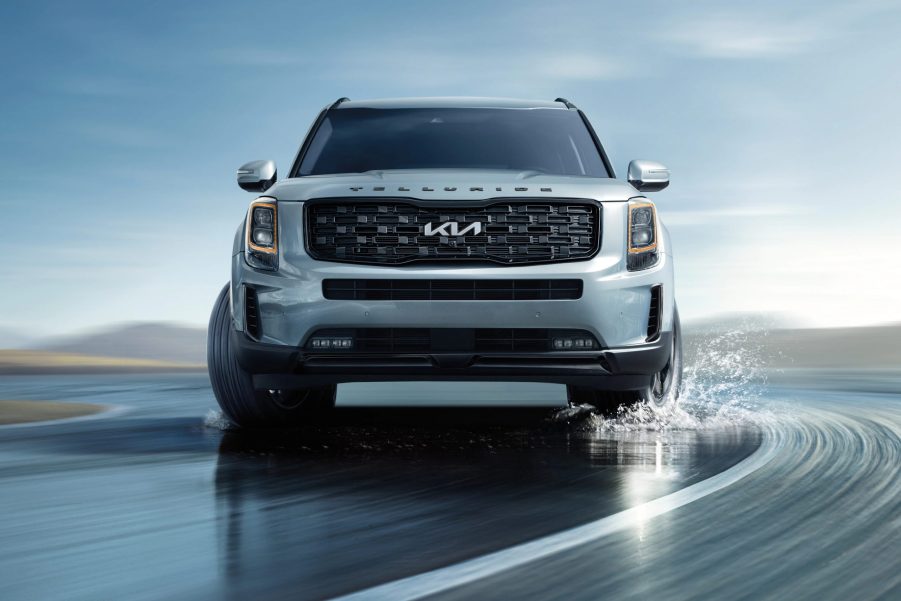 A 2022 Kia Telluride driving on the road with water on it, what's new for 2022?