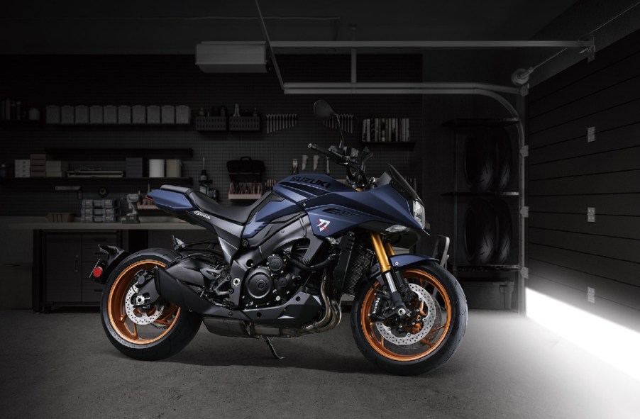 A dark-blue 2022 Suzuki Katana in a garage