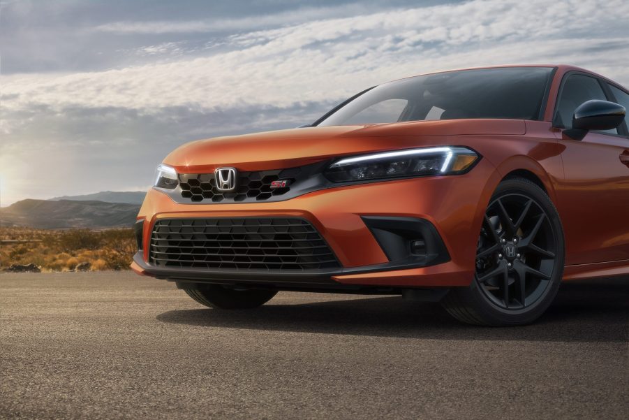 An orange VTEC-powered 2022 Honda Civic Si shot from the front