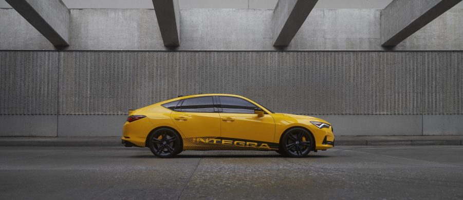 A profile shot of the 2023 Acura Integra in yellow