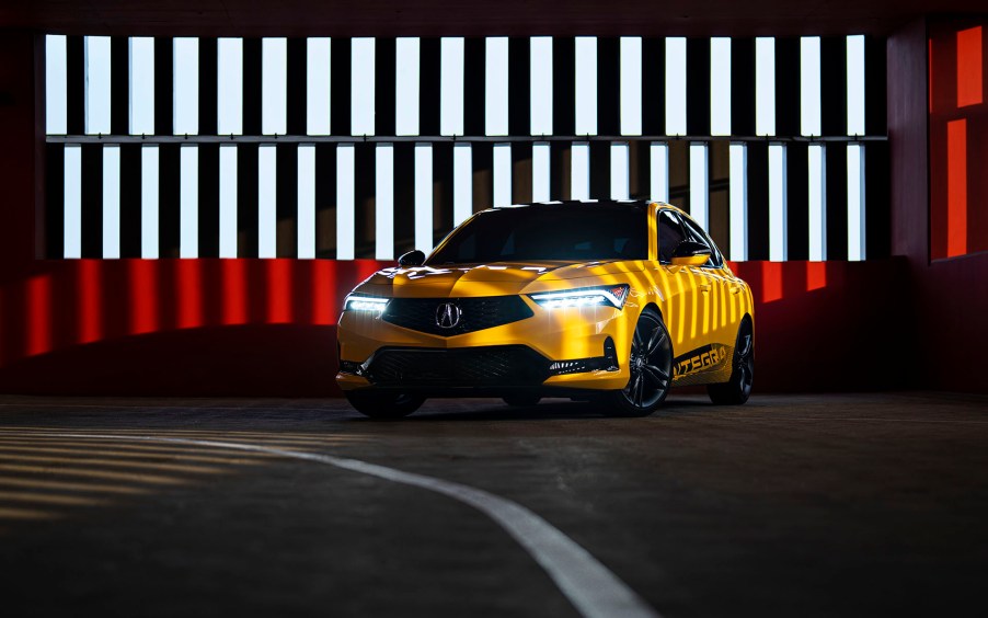 2022 Acura Integra Prototype painted in Indy Yellow Pearl photographed inside a parking garage. This prototype will be the base for the 2023 Acura Integra