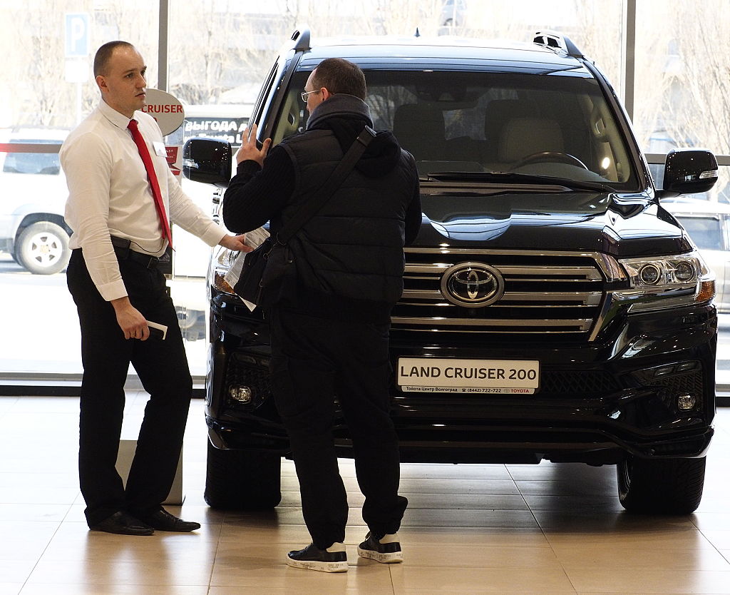  a customer at an AGAT Group dealership selling Toyota cars.