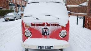 Classic camper van covered in snow