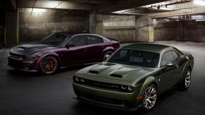 The 2022 Dodge Charger (left) and Challenger SRT Hellcat Redeye Widebody Jailbreak models. The Dodge Hellcat badge is ending production in 2023