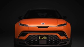 the Fisker Ocean SUV painted in orange seen from the direct front view