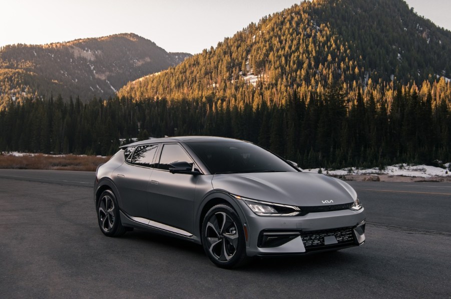 Gray 2022 Kia EV6 electric crossover SUV with mountains in the background