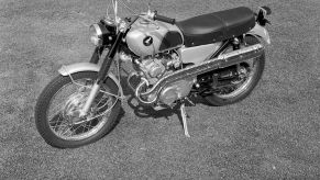 A Honda CL160 Scrambler parked on a lawn