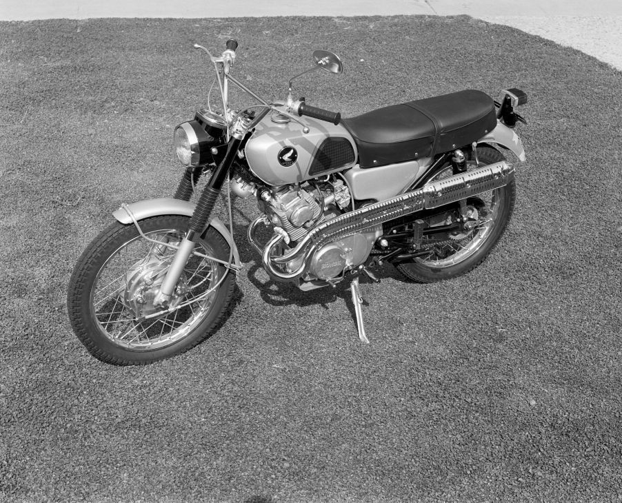 A Honda CL160 Scrambler parked on a lawn