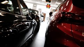 New cars sitting in dealership showroom