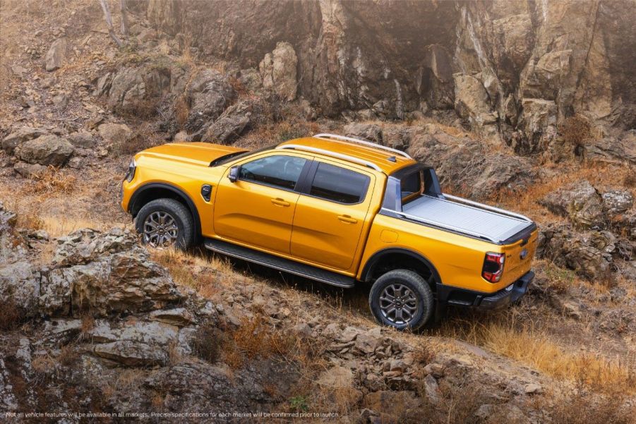 Orange 2023 Ford Ranger driving off-road on rocky terrain: A Ranger Raptor to follow?