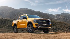 Orange 2023 Ford Ranger with mountains in the background