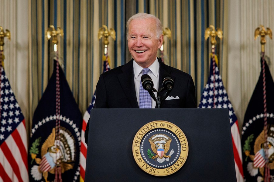 President Joe Biden signing a new infrastructure spending bill. The proposed EV tax credits had to be delayed