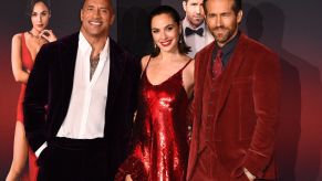 Dwayne Johnson, Gal Godot, and Ryan Reynolds | PATRICK T. FALLON/AFP via Getty Images