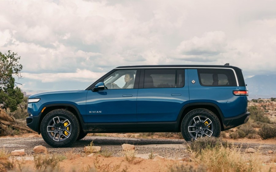 Rivian Blue 2022 Rivian R1S driving off-road in the desert