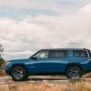 Rivian Blue 2022 Rivian R1S EV SUV driving off-road in the desert