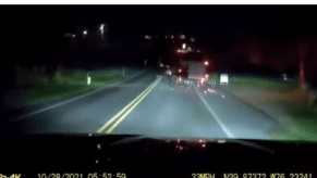 Amish horse and buggy drifting across two lanes of traffic