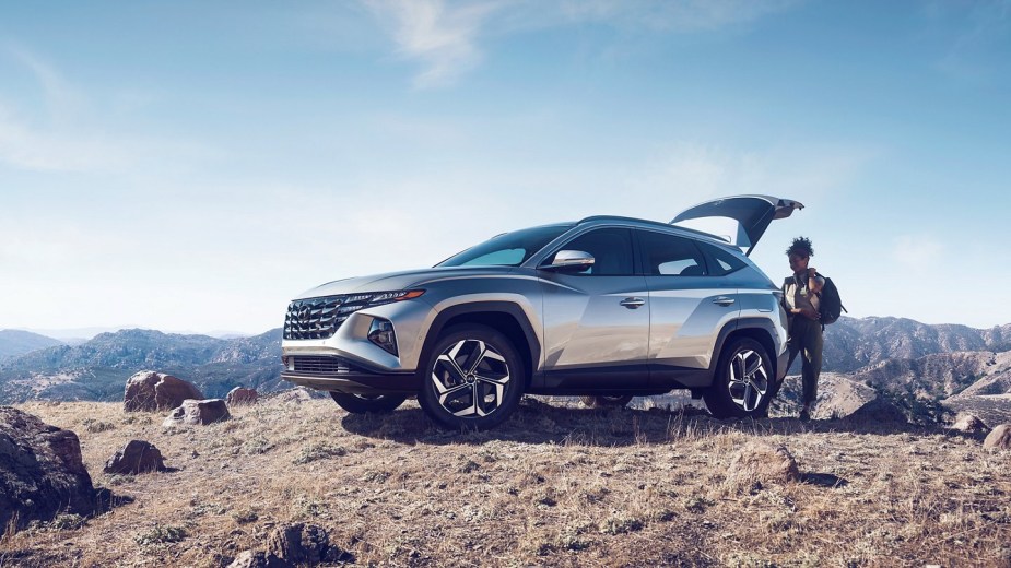 Shimmering Silver 2022 Hyundai Tucson parked on top of a mountain