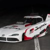 Toyota GR Supra NHRA Funny Car drag racer in a white red and black livery