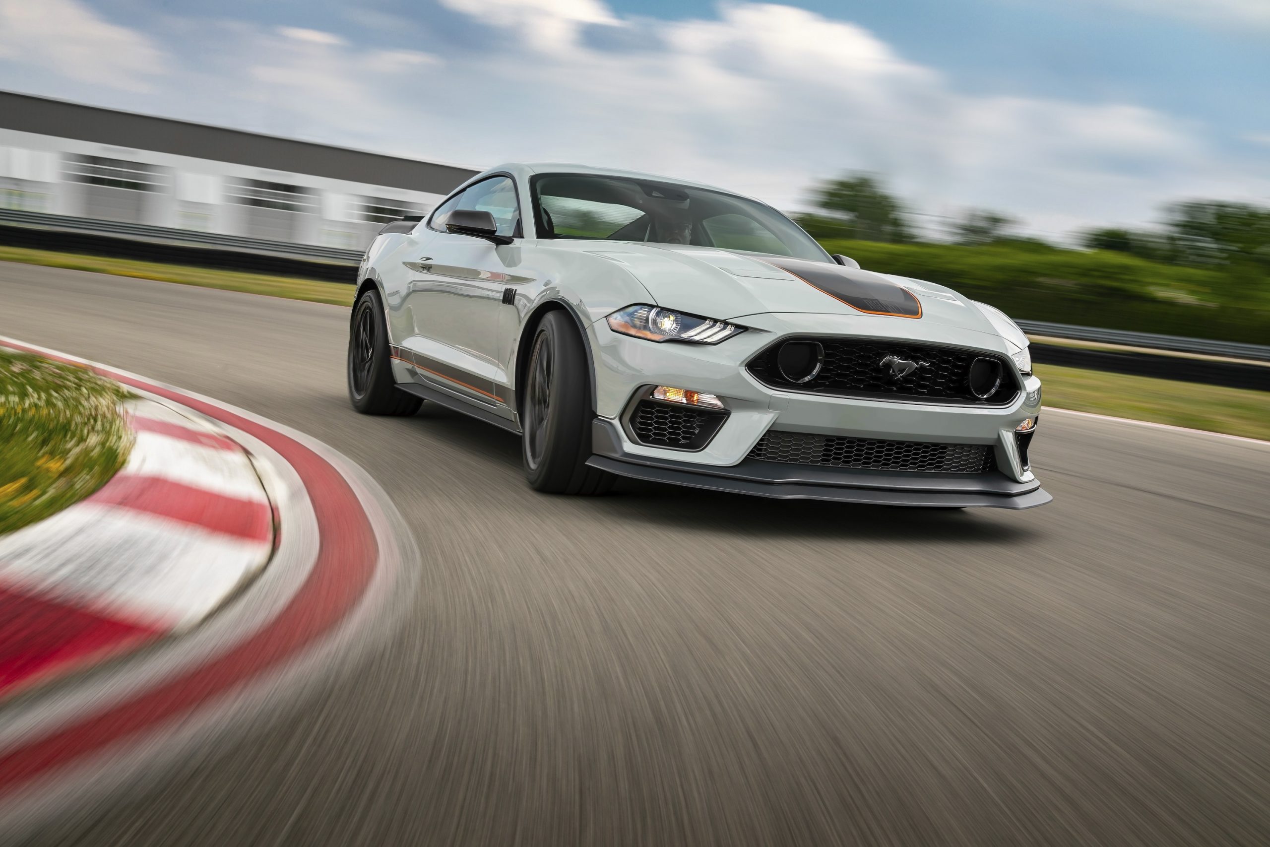 The new Mustang Mach 1 in grey shot from the 3/4 angle on a race track