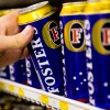 A man was seen drinking beer on the hood of a Ford Ute