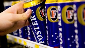 A man was seen drinking beer on the hood of a Ford Ute